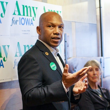 Ross Wilburn speaking at a campaign event for Amy Klobuchar