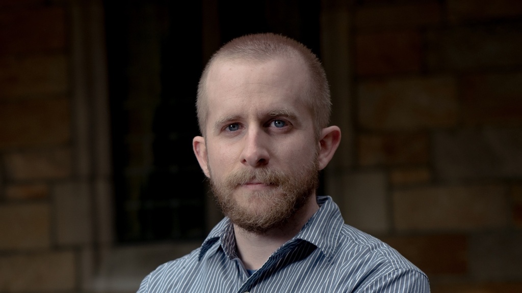 A headshot of University of Iowa assistant professor Jay Kayser. 